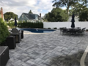 nicolock granite city alpine smooth brick paver patio around pool bullnose coping